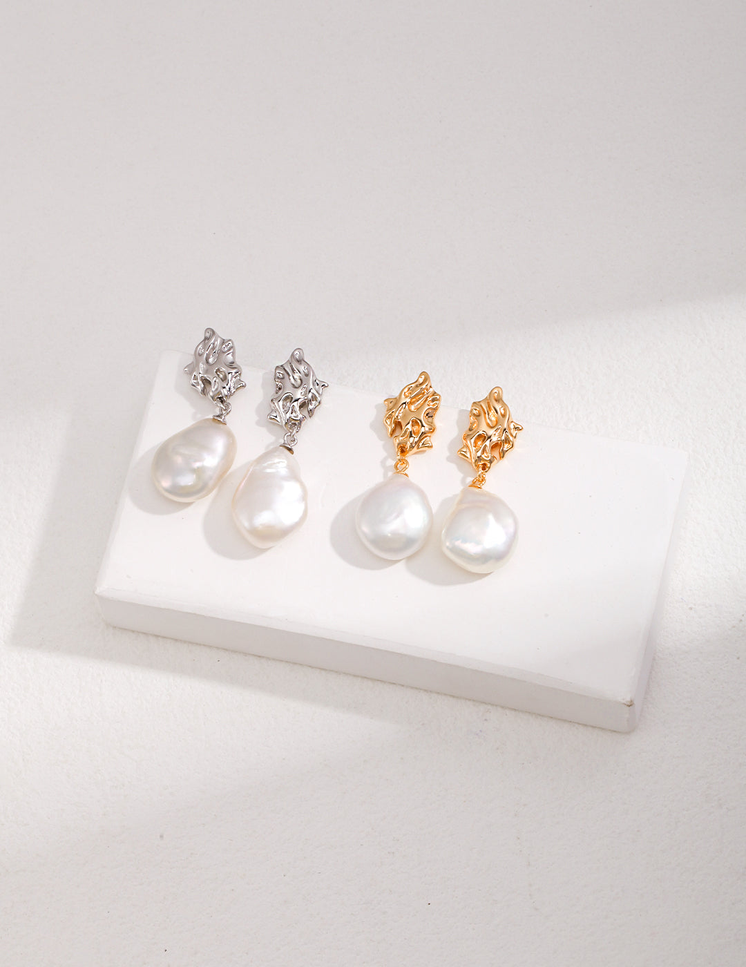 Three pairs of dreamy baroque pearl earrings in gold and silver, highlighting their unique charm and elegance.