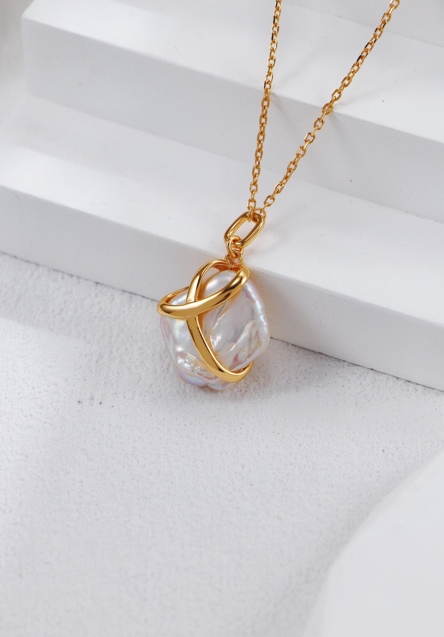Stunning gold-plated necklace pendant with a white baroque pearl, elegantly designed, perfect for gifting to mom with a ribbon.