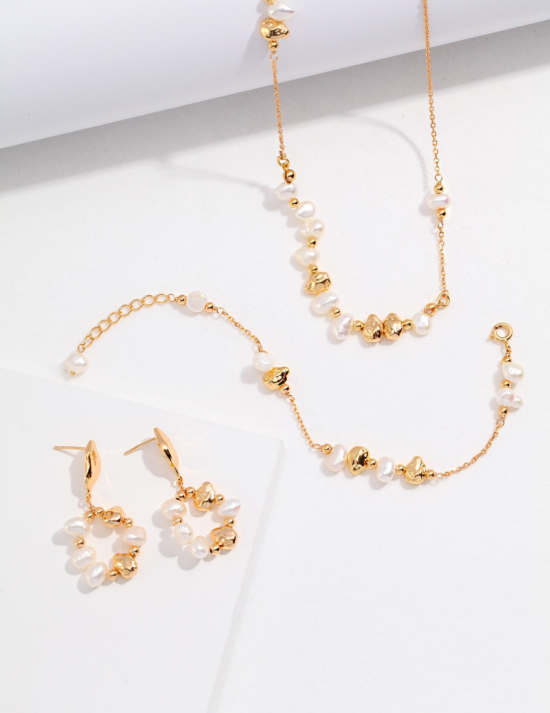 Timeless gold plated jewelry set with freshwater pearls, complete with a matching bracelet for a classic look.