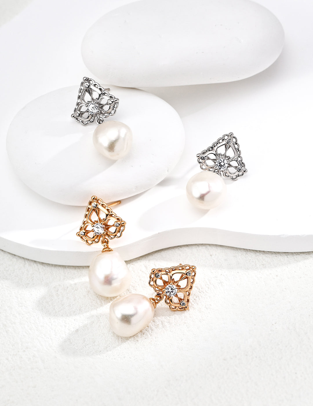 Two sets of zirconia pearl drop earrings in Silver and Gold, by Mezuille.