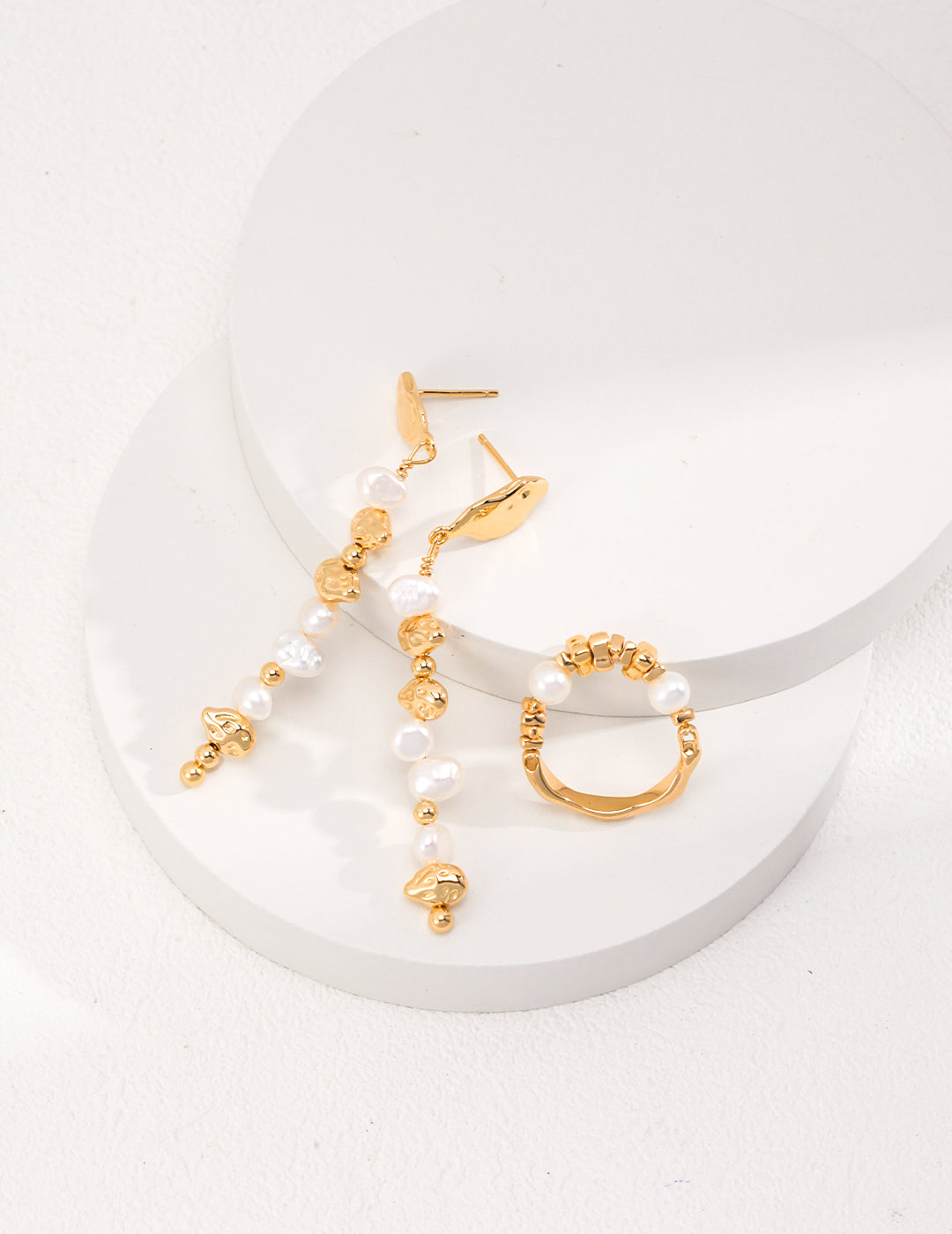 Stylish gold plated earrings featuring delicate pearl beads, complementing a set with gold pearls ring.