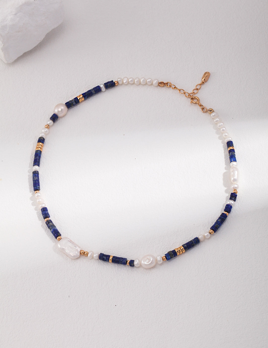 Elegant cobalt blue and white pearl beaded necklace.
