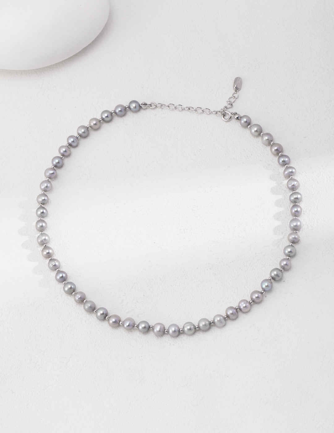 A stunning necklace made of grey freshwater pearls.
