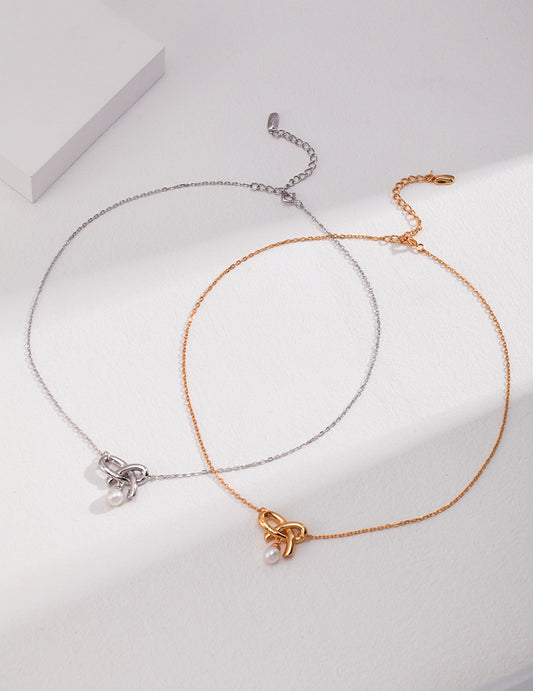 Elegant silver and gold pearl knot necklaces.