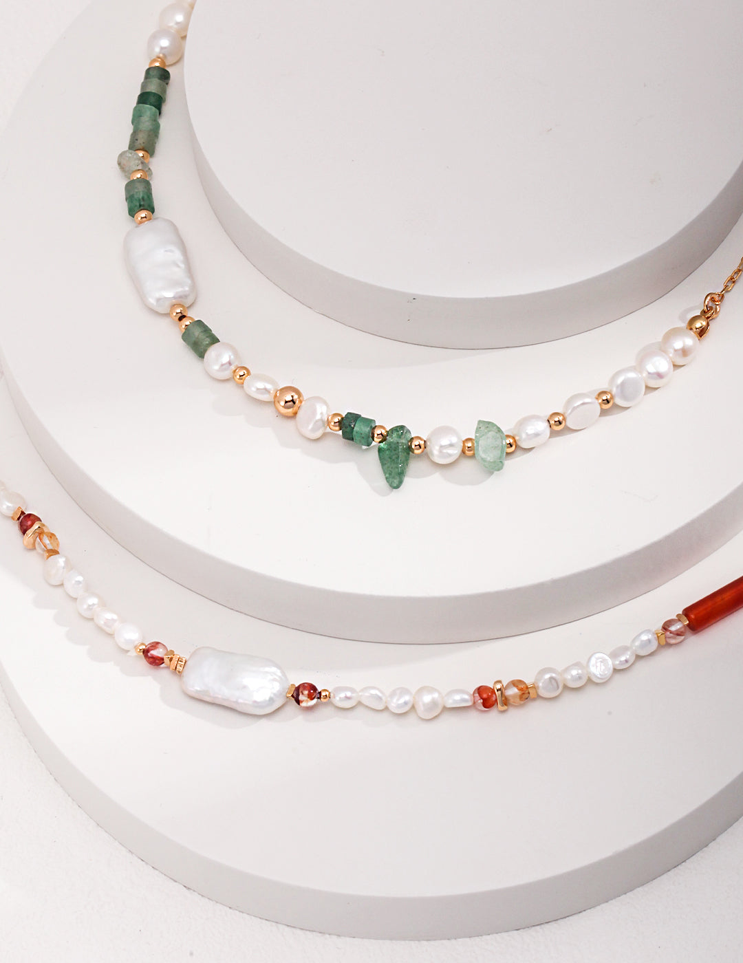 Freshwater pearl necklace and bracelet set with coral beads and strawberry quartz, elegant and stylish accessories.