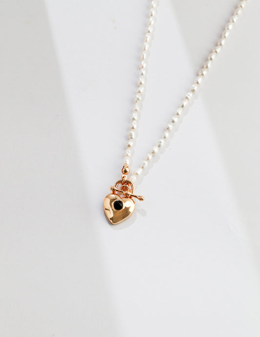 Delicate rice pearl necklace with gold plated heart pendant
