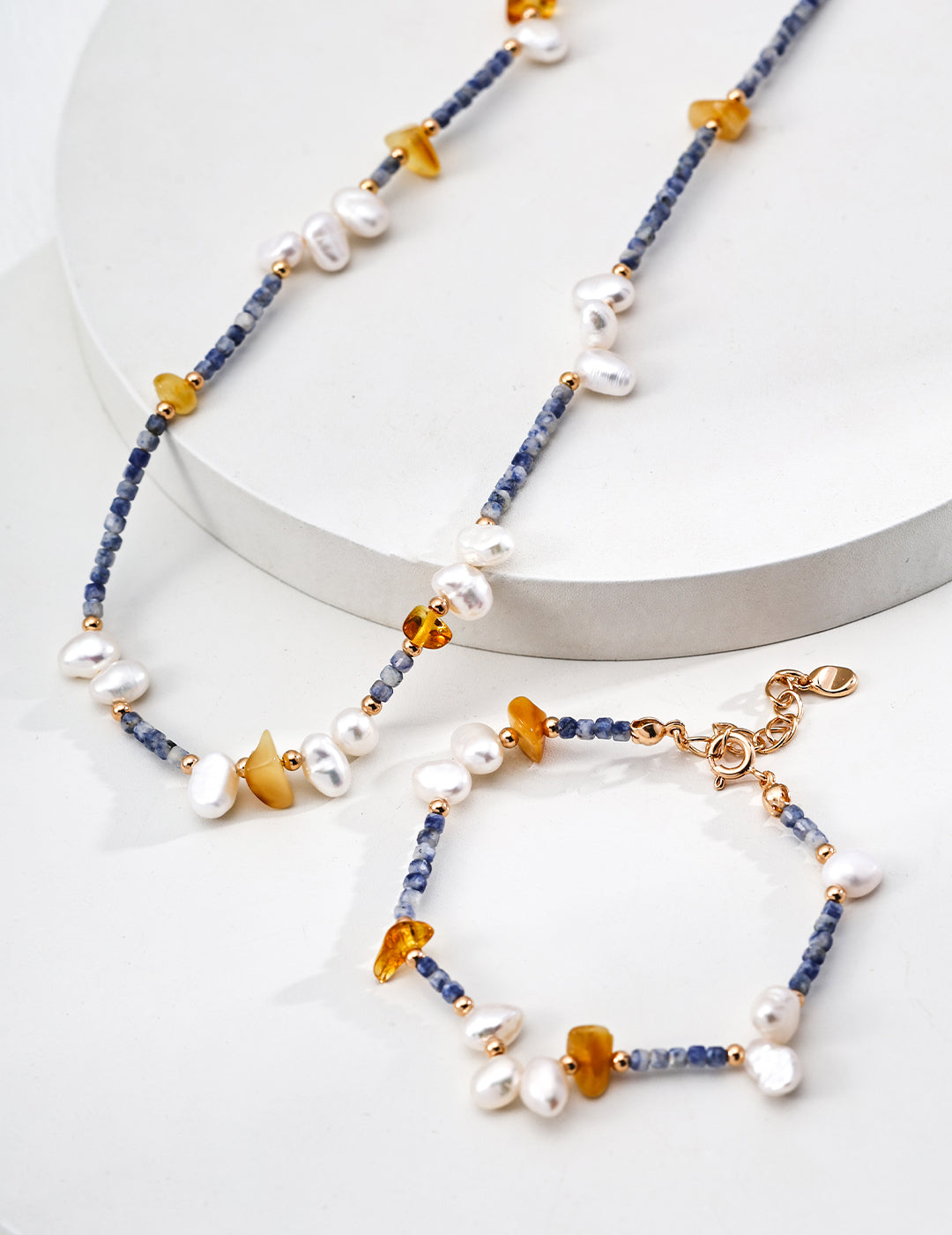Elegant necklace and bracelet set with blue and yellow beads, made from Azurite in Granite, Beeswax, and Freshwater Pearls.