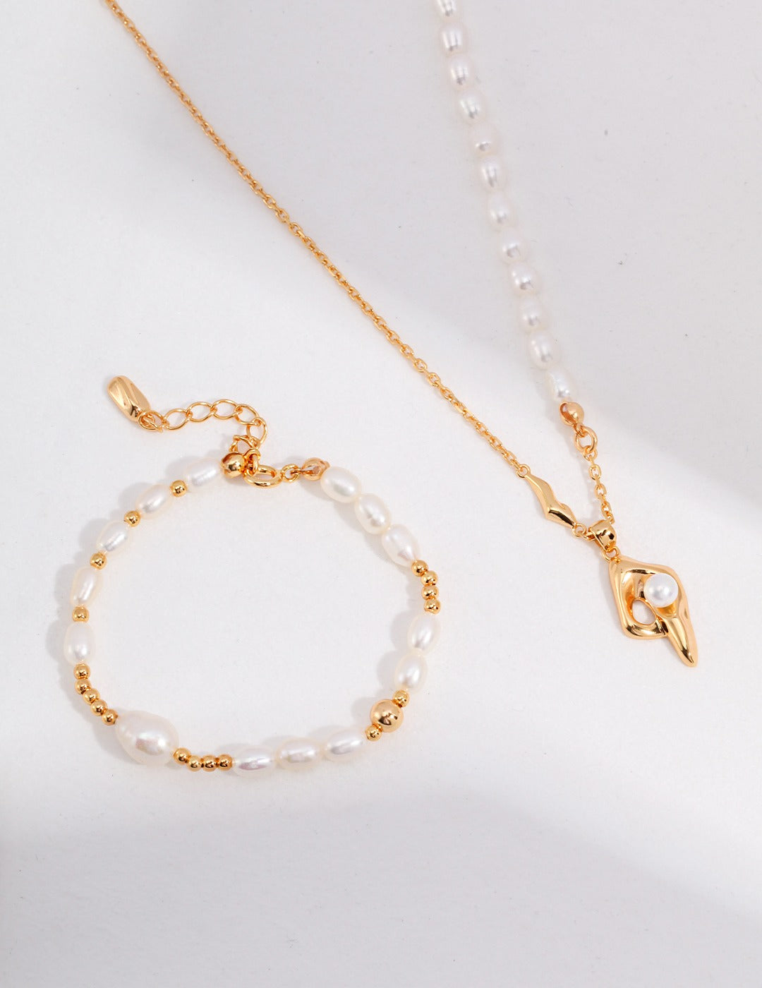 Gold beaded freshwater pearls bracelet and matching necklace set.