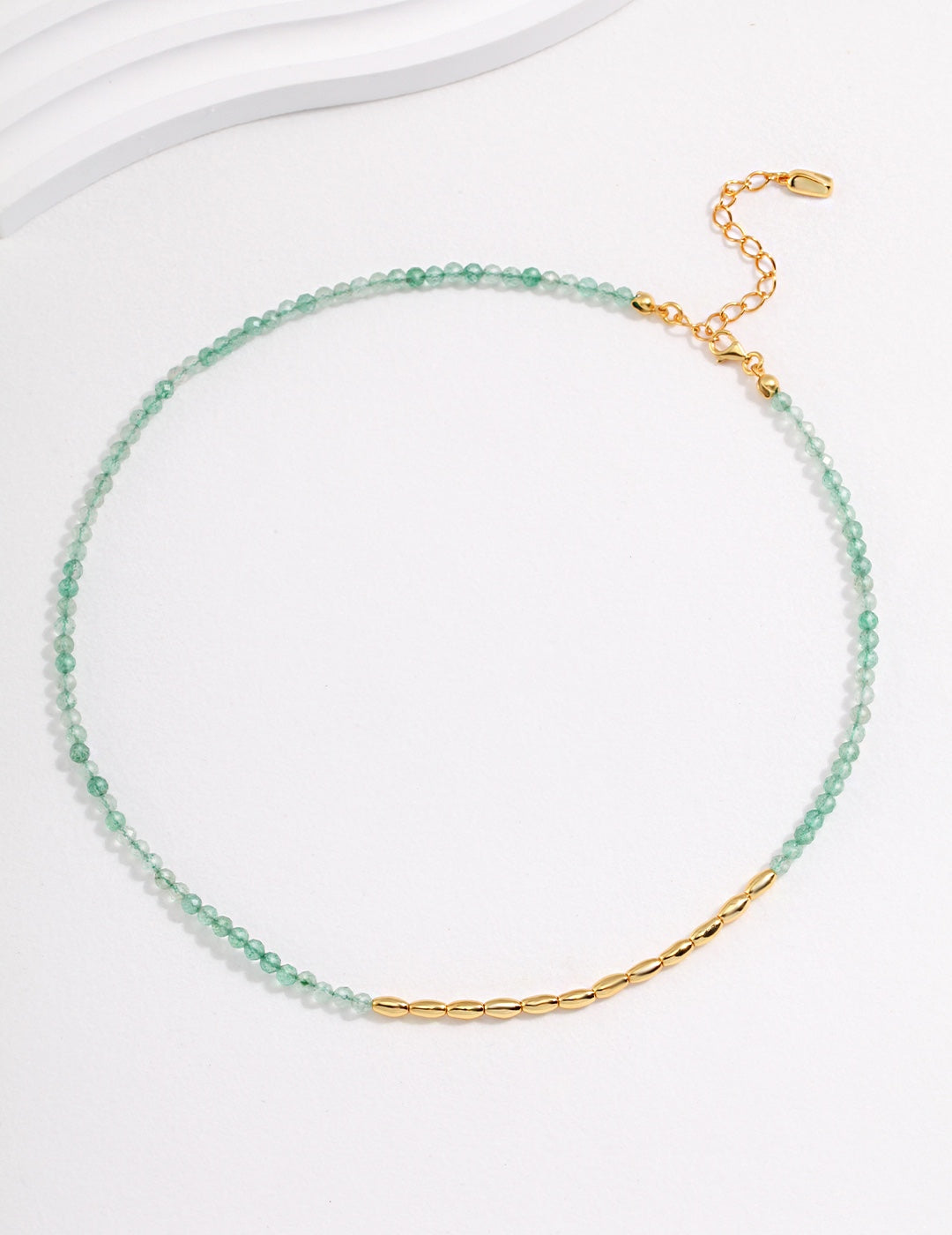 Gold and green choker with bar, adorned with Green Strawberry Quartz.