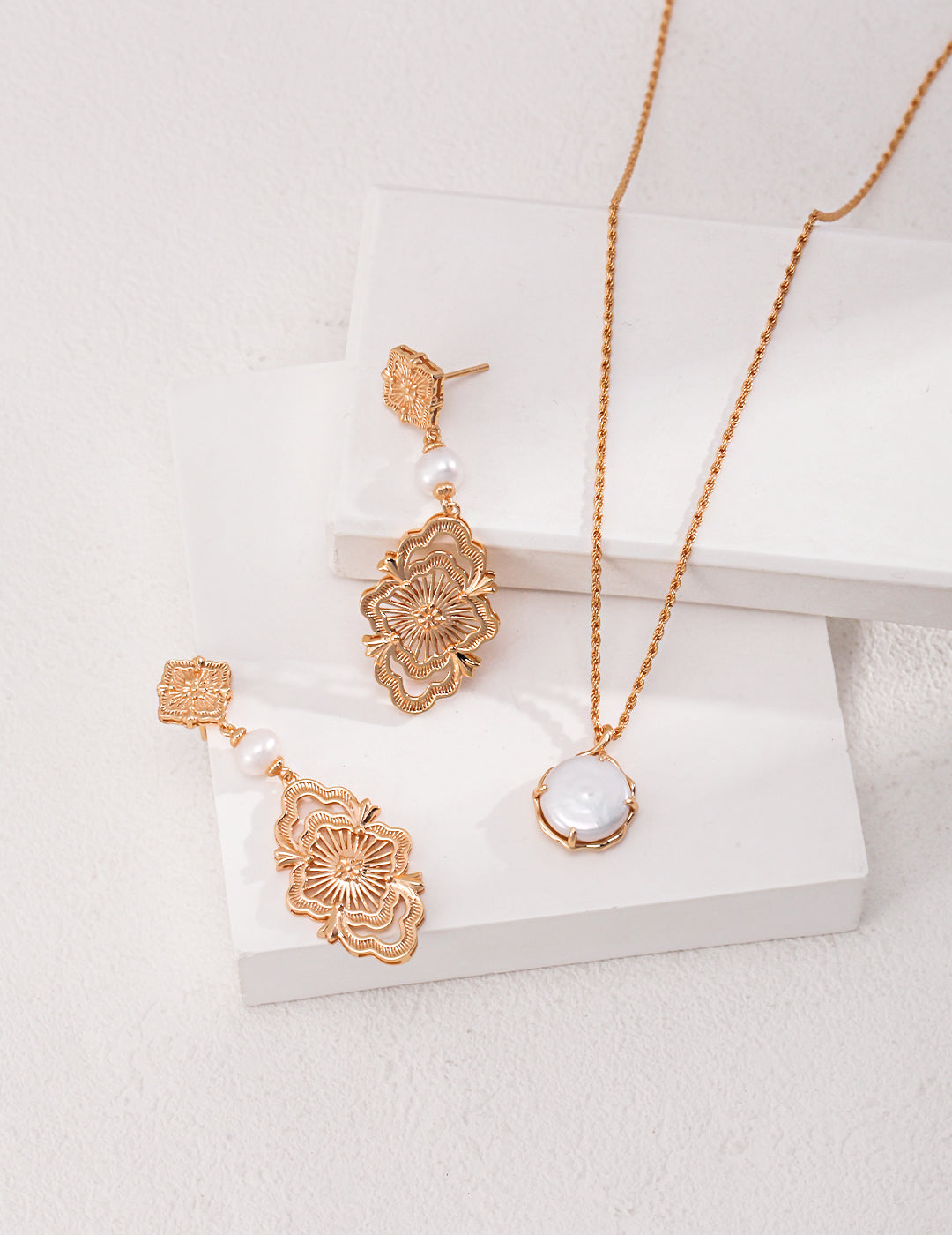 Gold plated necklace and earrings with noble freshwater pearls, creating a stunning matching set.