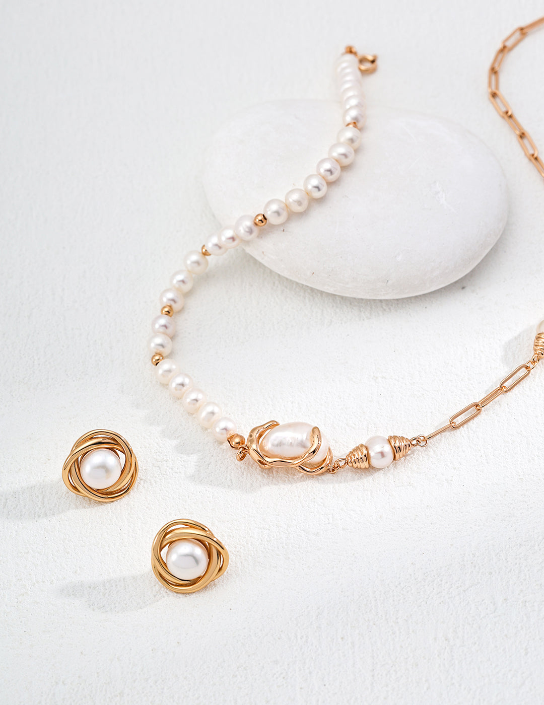 Beautiful pearl necklace and earrings set, a perfect matching duo for a chic and elegant look.