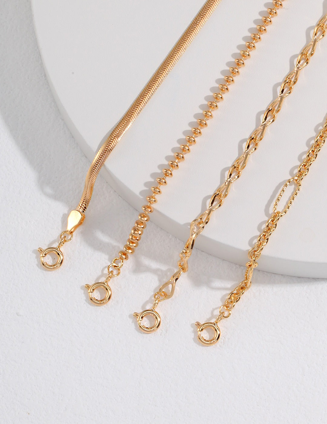 Detailed view of gold chains with clasps, close up shot.