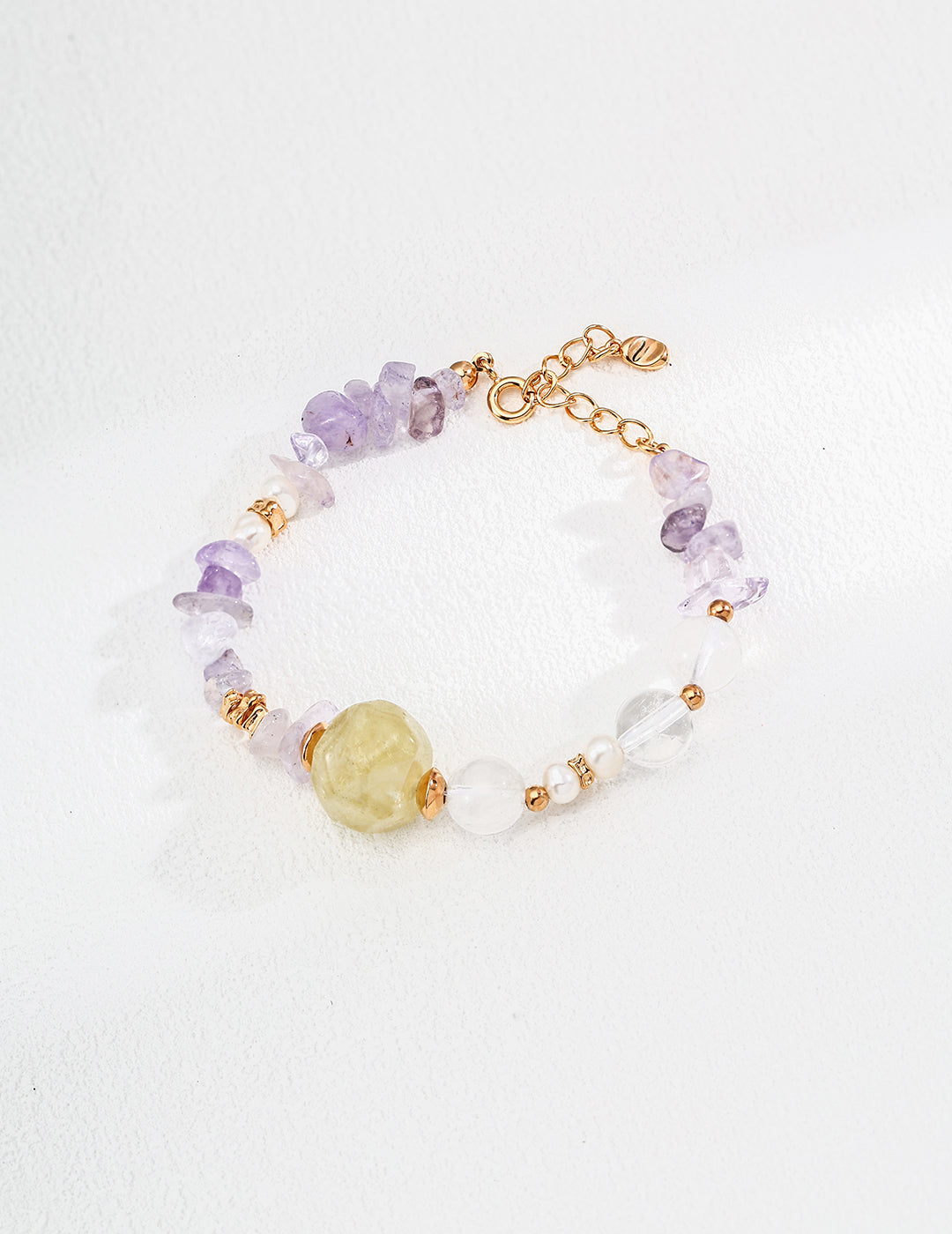 A bracelet crafted with purple amethyst and white citrine beads, showcasing a beautiful color combination.
