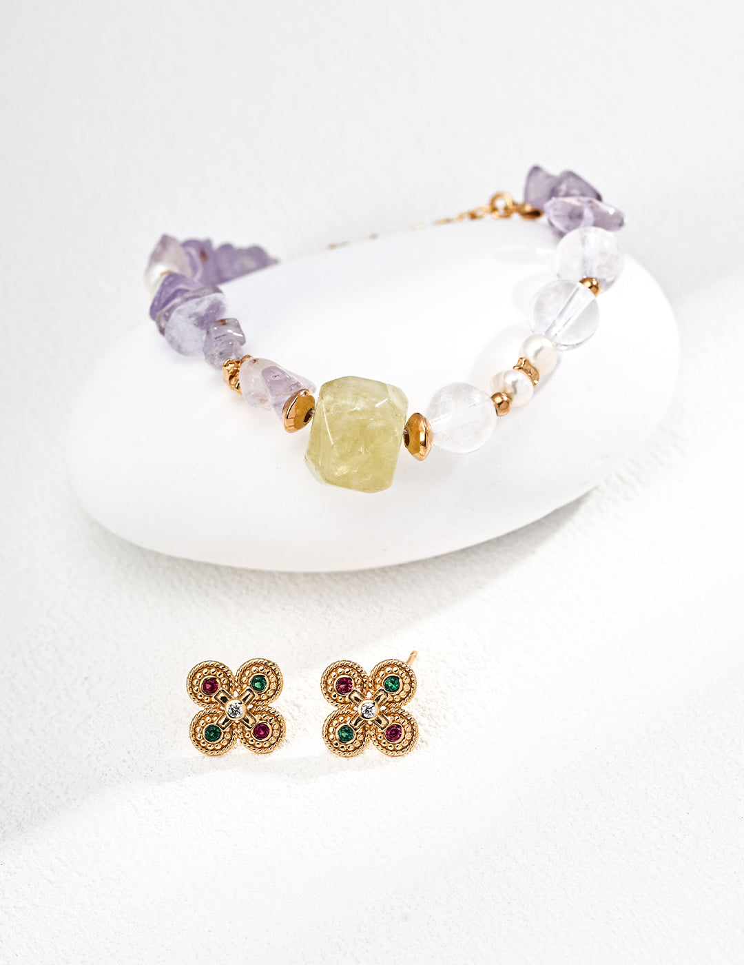 Bracelet adorned with purple amethyst, complemented by clear quartz and citrine beads.with matching earrings below.