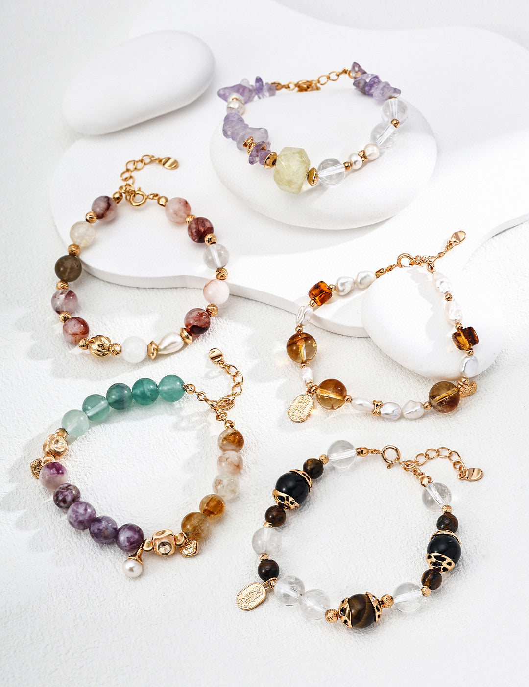 Set of colorful beaded bracelets on a white surface, highlighting a playful and creative accessory style.