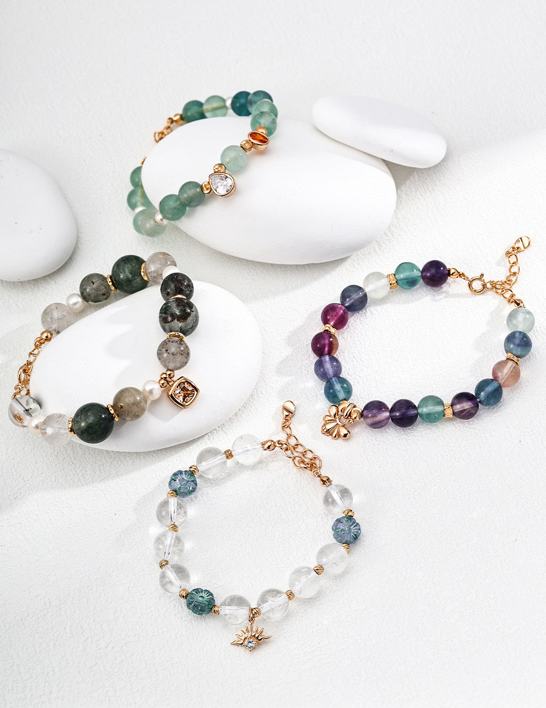Set of beaded bracelets on a white surface