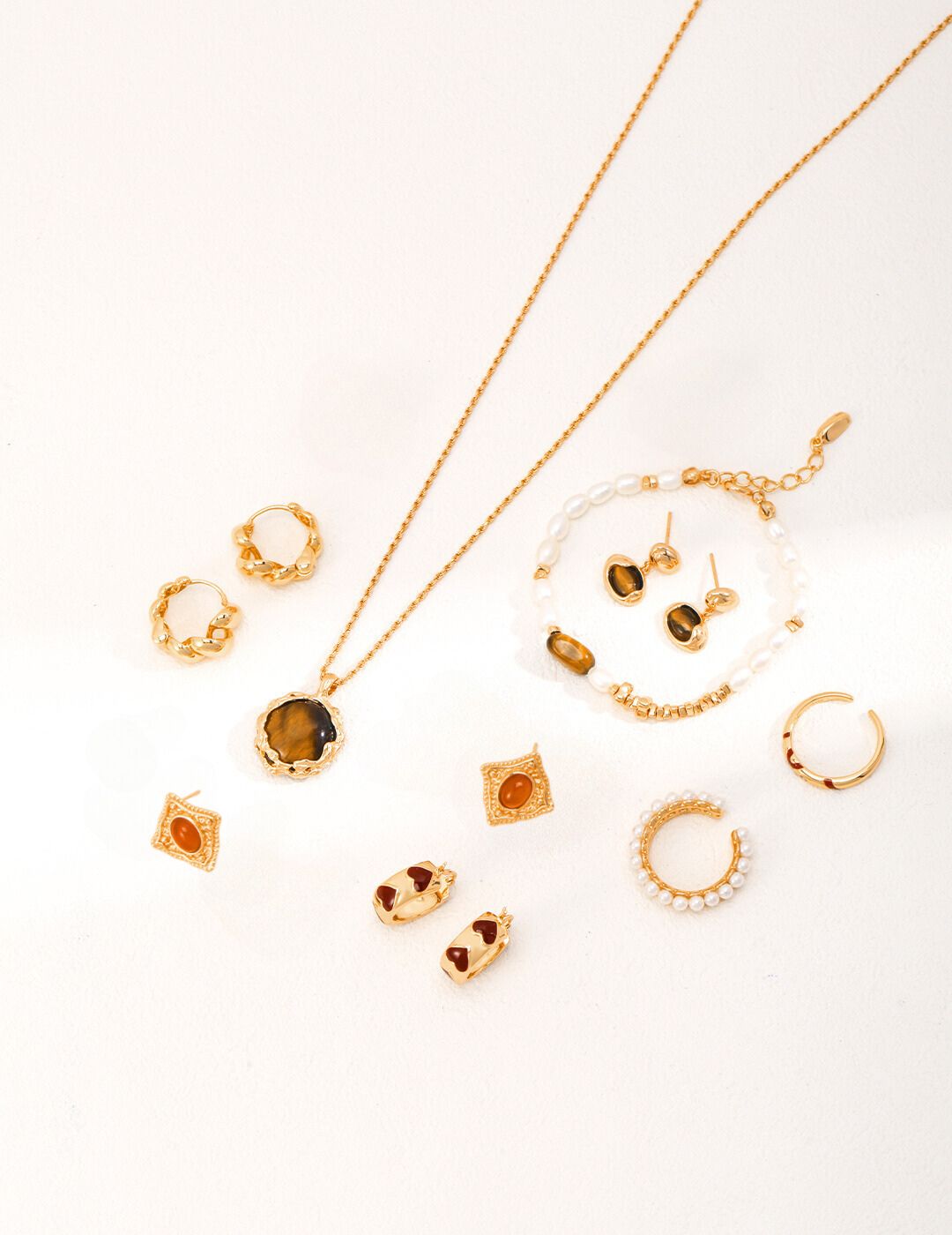 Sets of matching gold jewelry.