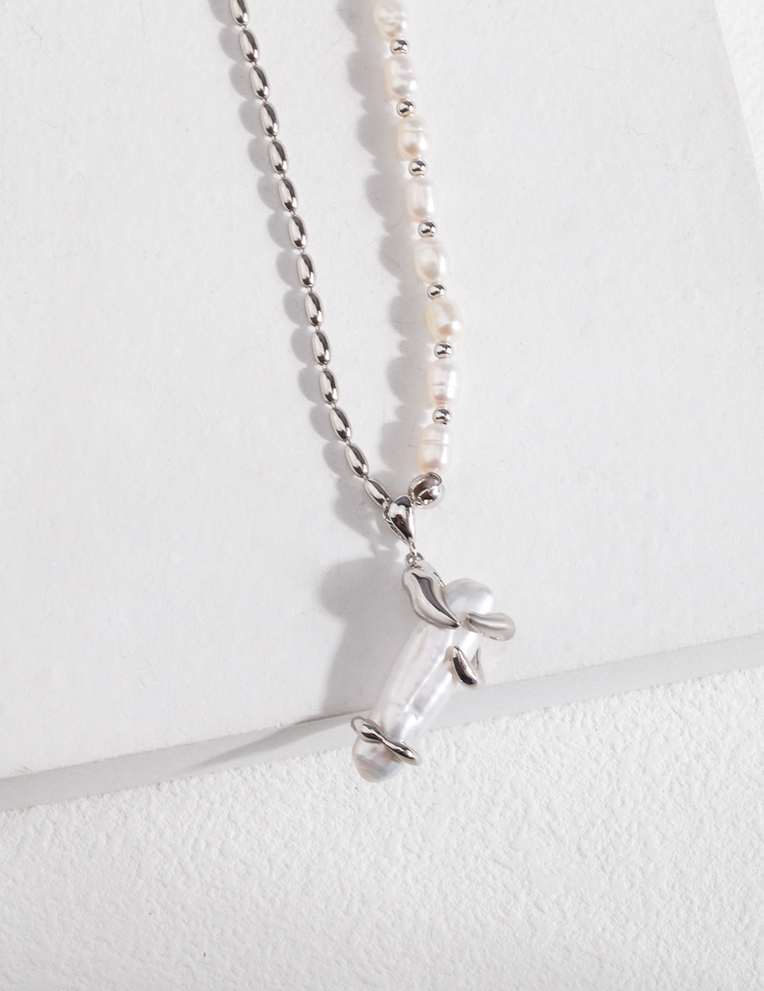 Silver baroque pearls necklace with a cross pendant