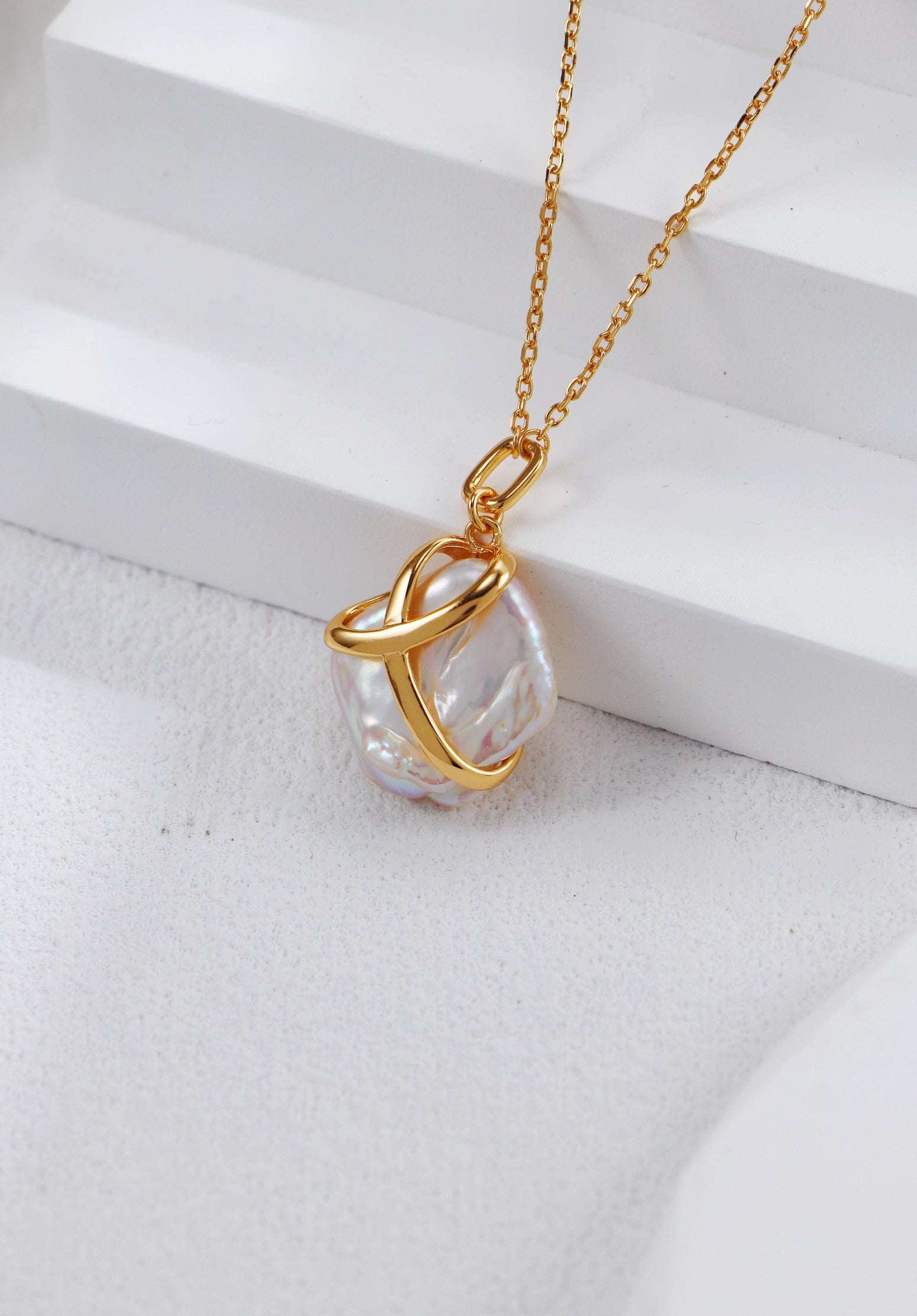 Stunning gold-plated necklace pendant with a white baroque pearl, elegantly designed, perfect for gifting to mom with a ribbon.