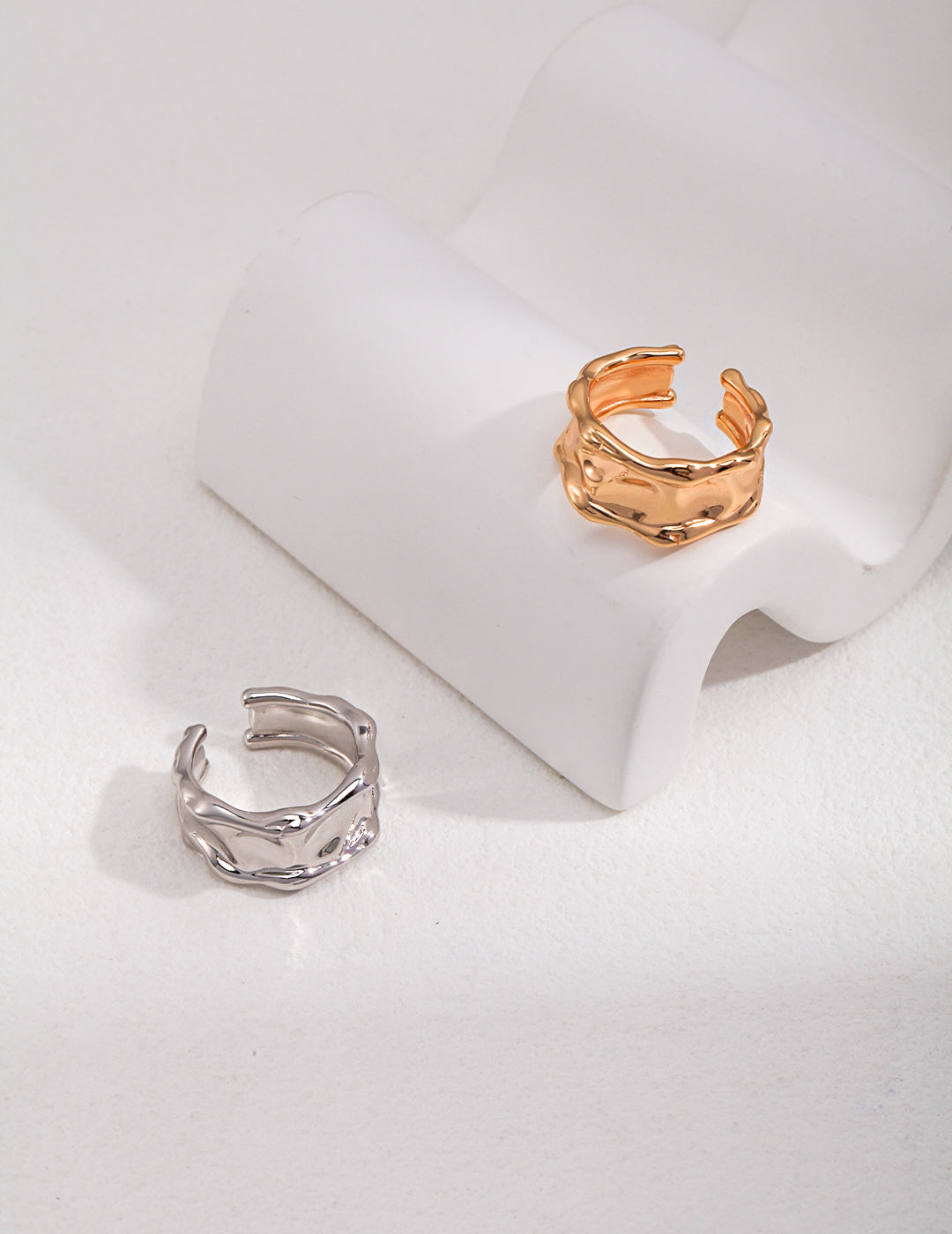 Gold and silver rings featuring unique and ornate designs.