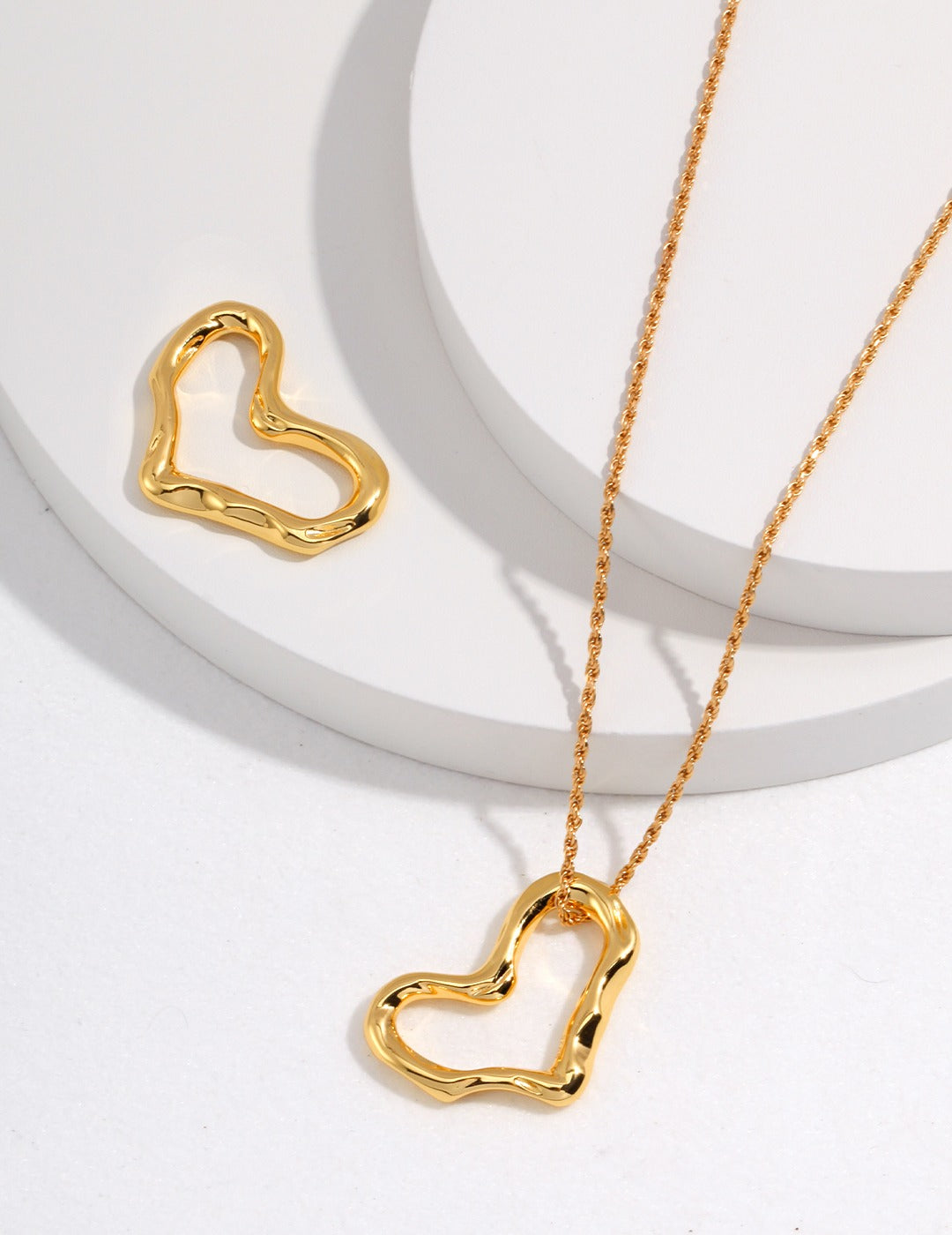 Stylish gold heart pendants, ideal for mixing and matching with a gold necklace.