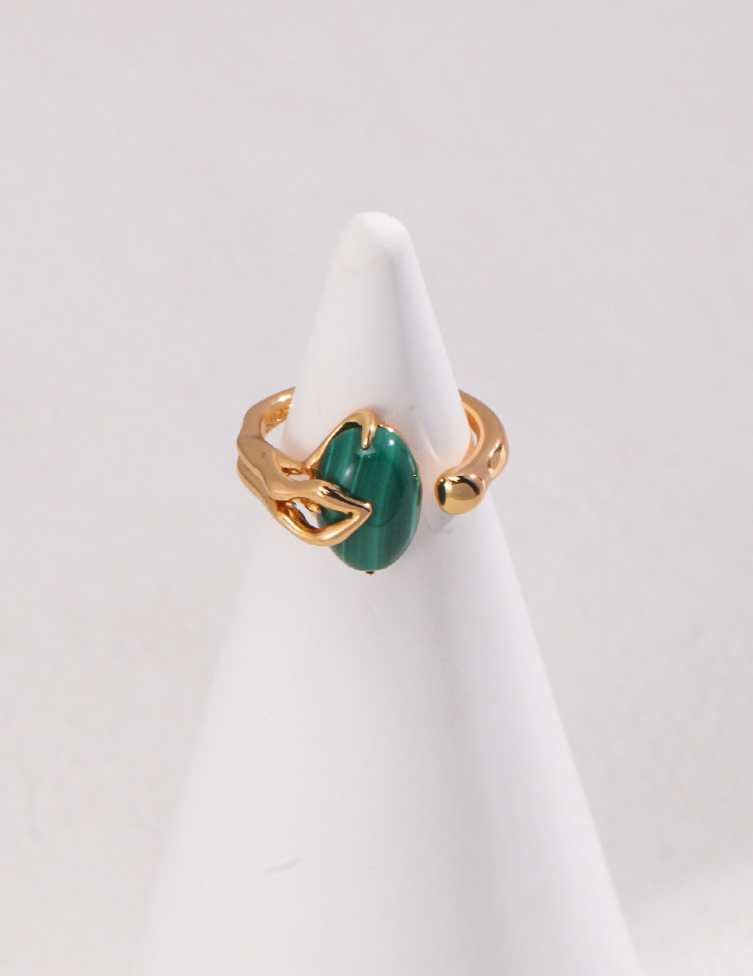 A gold plated ring with a malachite stone.