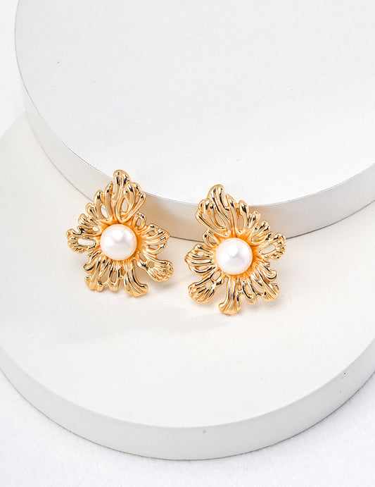 Elegant gold tone flower earrings, showcasing intricate petal designs that add a touch of sophistication to any outfit.