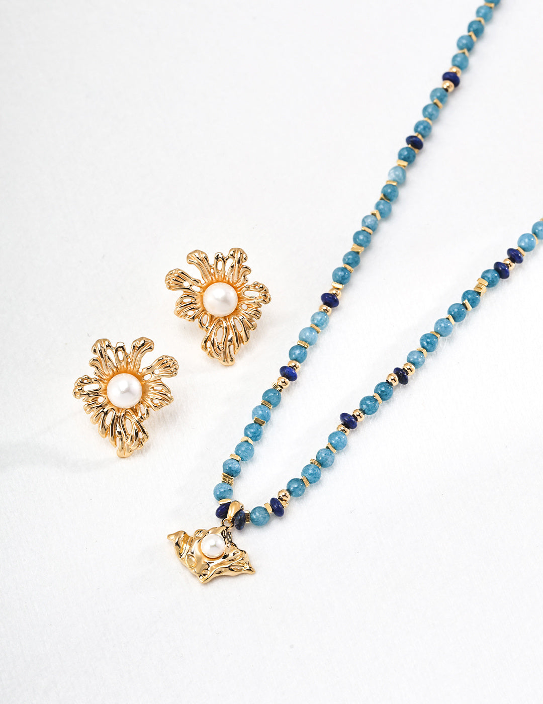 Charming necklace and earrings set embellished with striking blue beads, a perfect choice for enhancing your look.