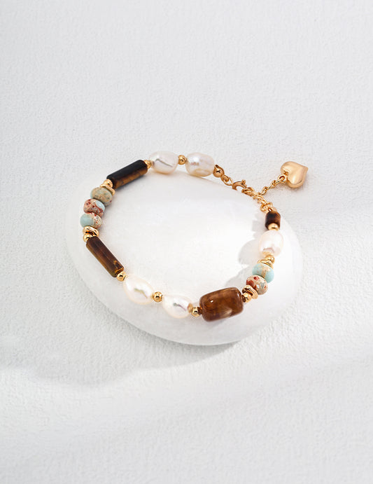 Chic bracelet showcasing a gold-plated charm alongside a striking stone, a perfect accessory for any occasion.