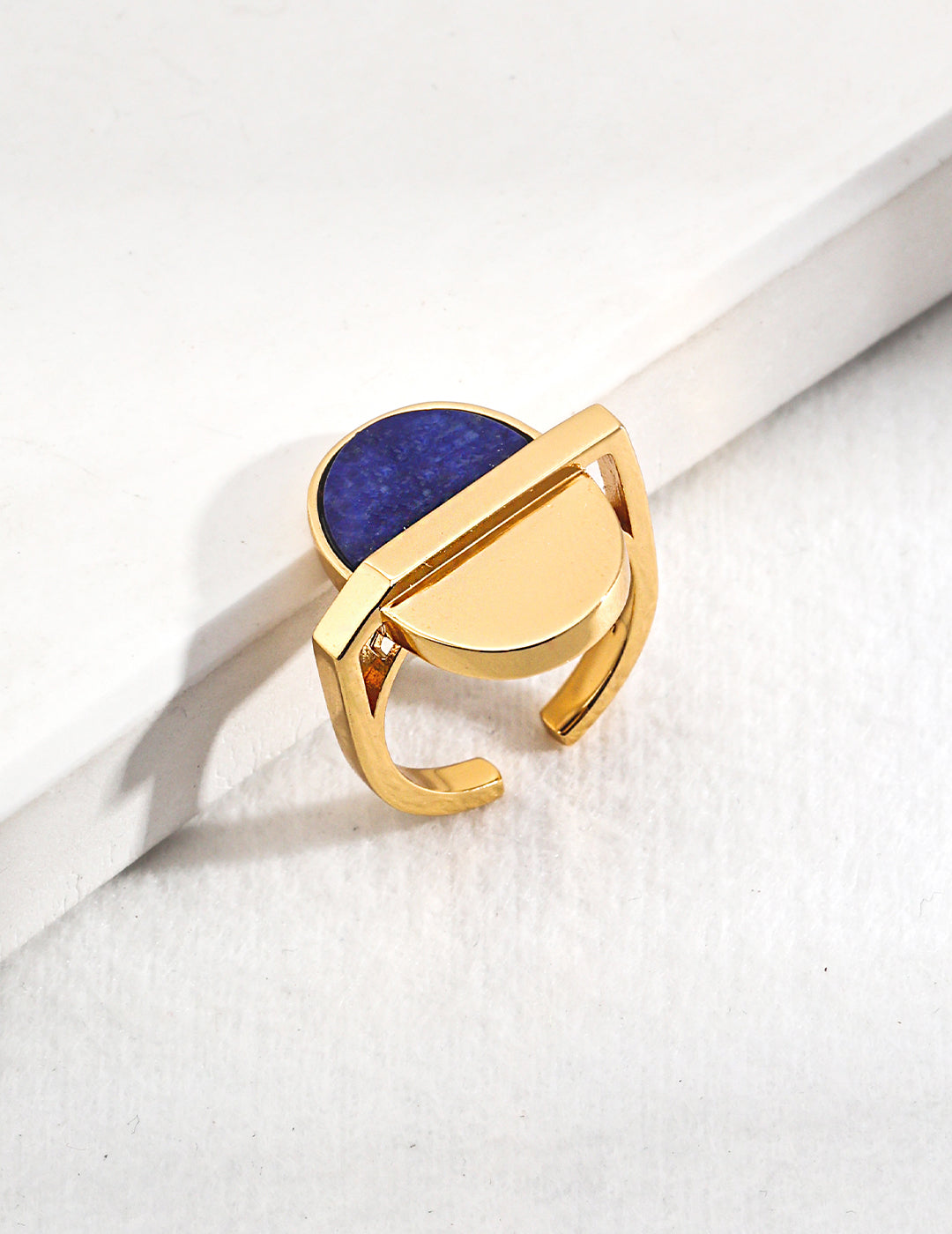 Gold plated ring with blue lapis lazuli stone.