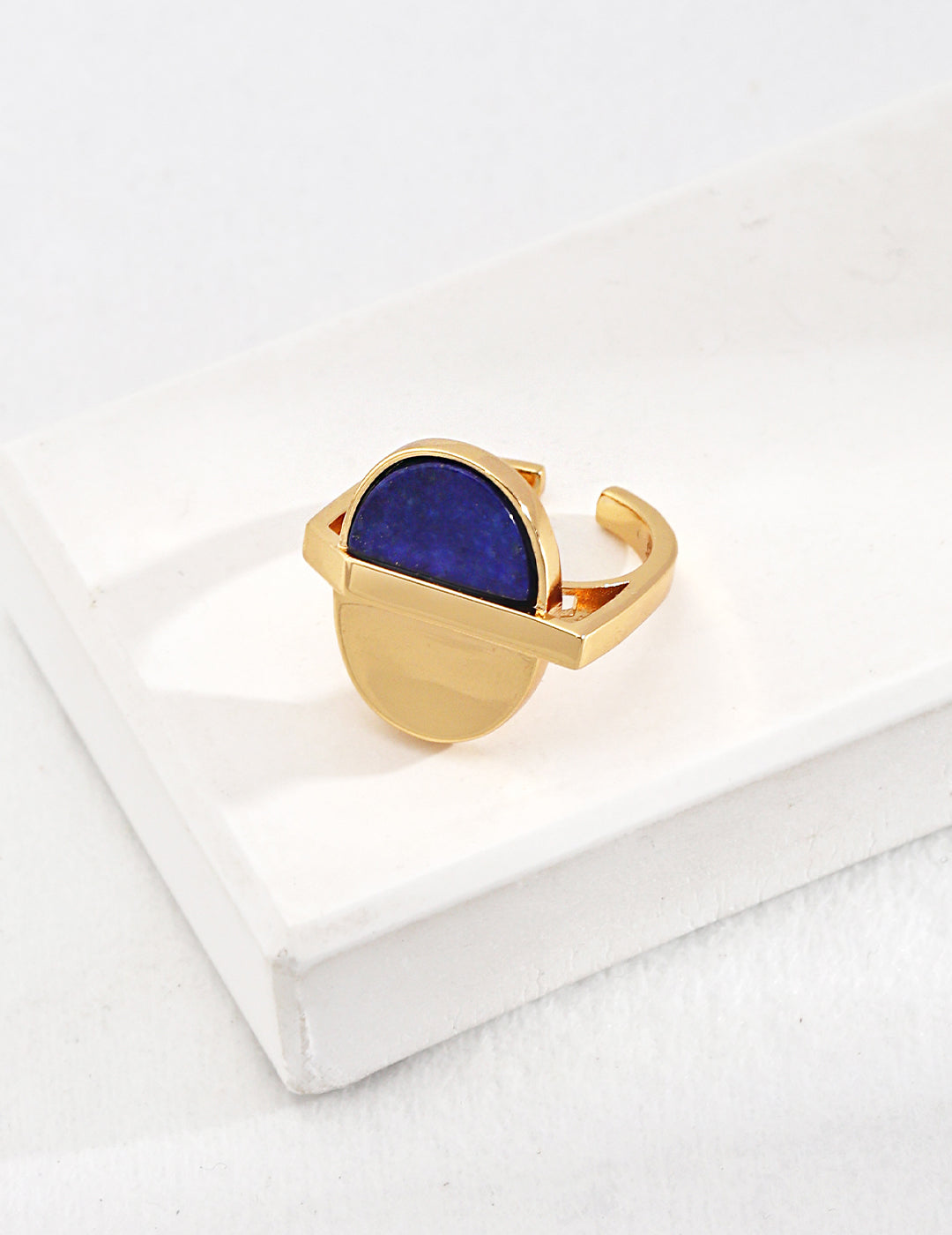 A stunning gold-plated ring featuring a captivating blue lapis lazuli stone.