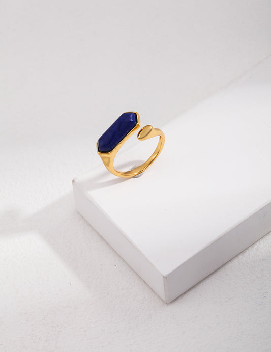 A gold-plated ring with a stunning blue lapis lazuli stone.