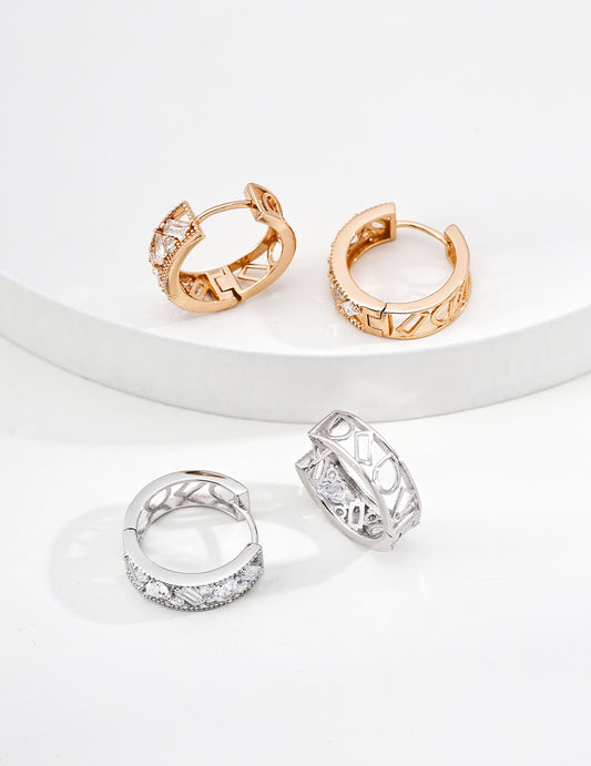 Two sets of Edith Hoops ,minimal zirconia hoops in Gold and Silver by Mezuille, quiet luxury style.