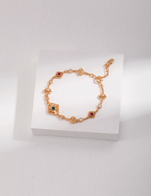 A retro gold-plated bracelet adorned with colored cubic zirconia.