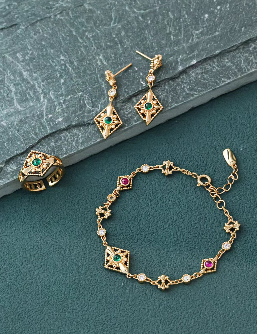 Elegant gold jewelry set featuring a bracelet, earrings, and a ring, perfect for any special occasion.