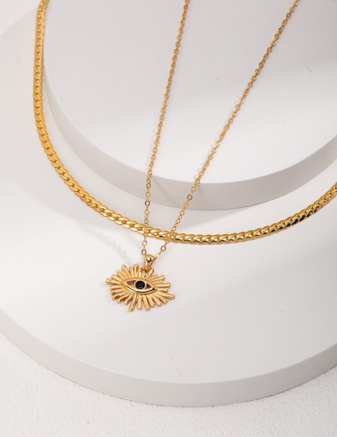 Gold plated necklace with evil eye pendant, perfect for layering.