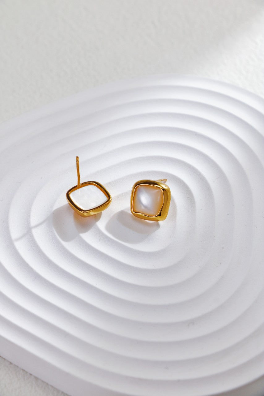 Front and back view of gold plated square stud earrings, highlighting their sleek and stylish appearance.