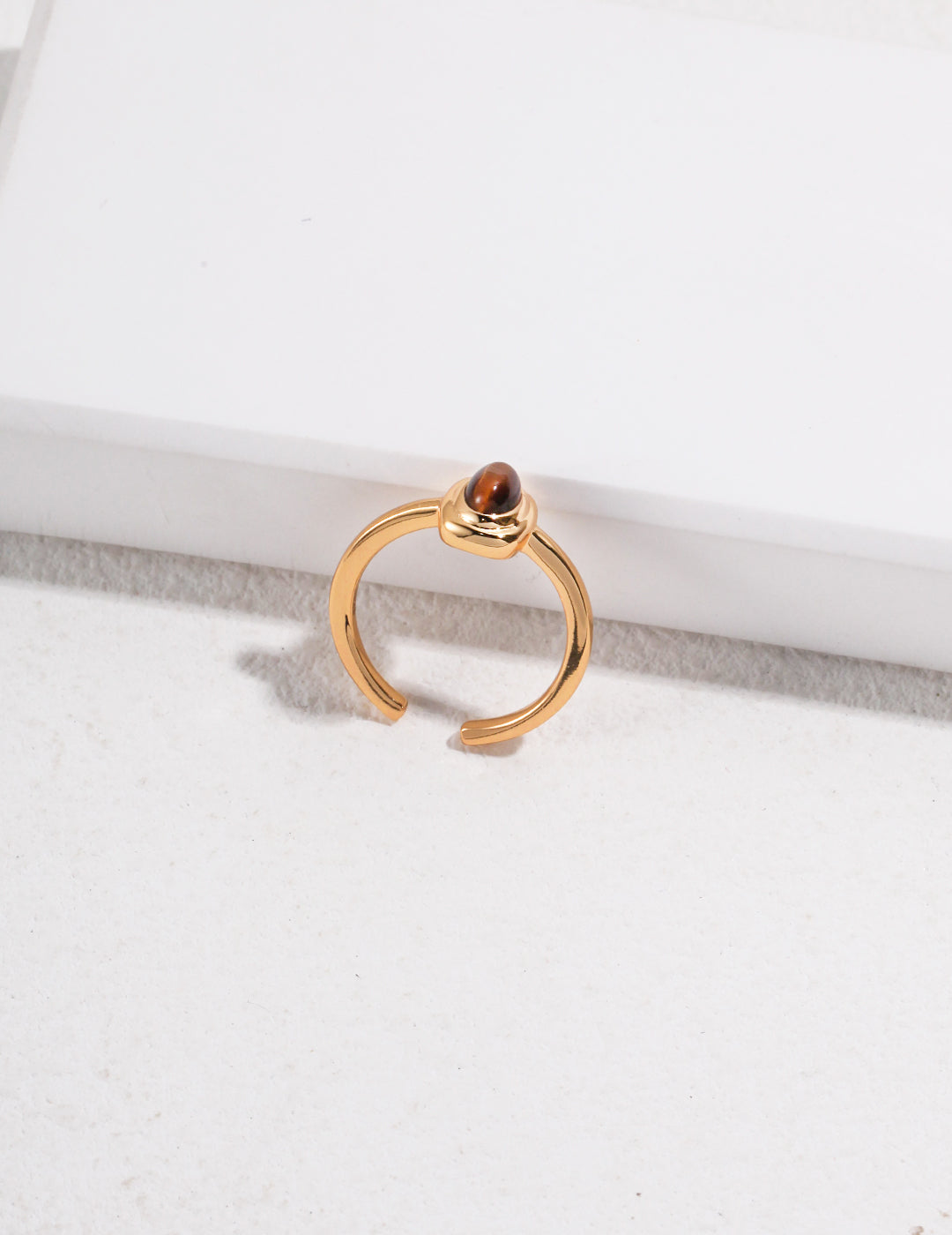 Exquisite gold ring adorned with a captivating tiger's eye gemstone.