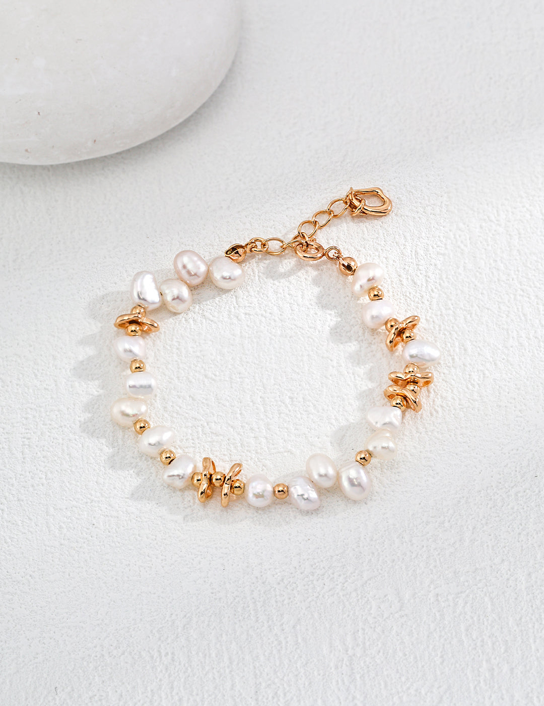 An exquisite gold plated freshwater pearls bracelet, radiating luxury and grace.