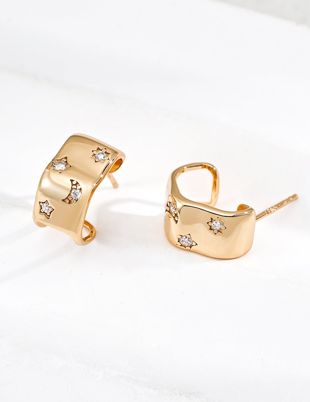 Gold C-Shaped Hoops from Mezuille, with celestial zirconia accent, displayed on white background