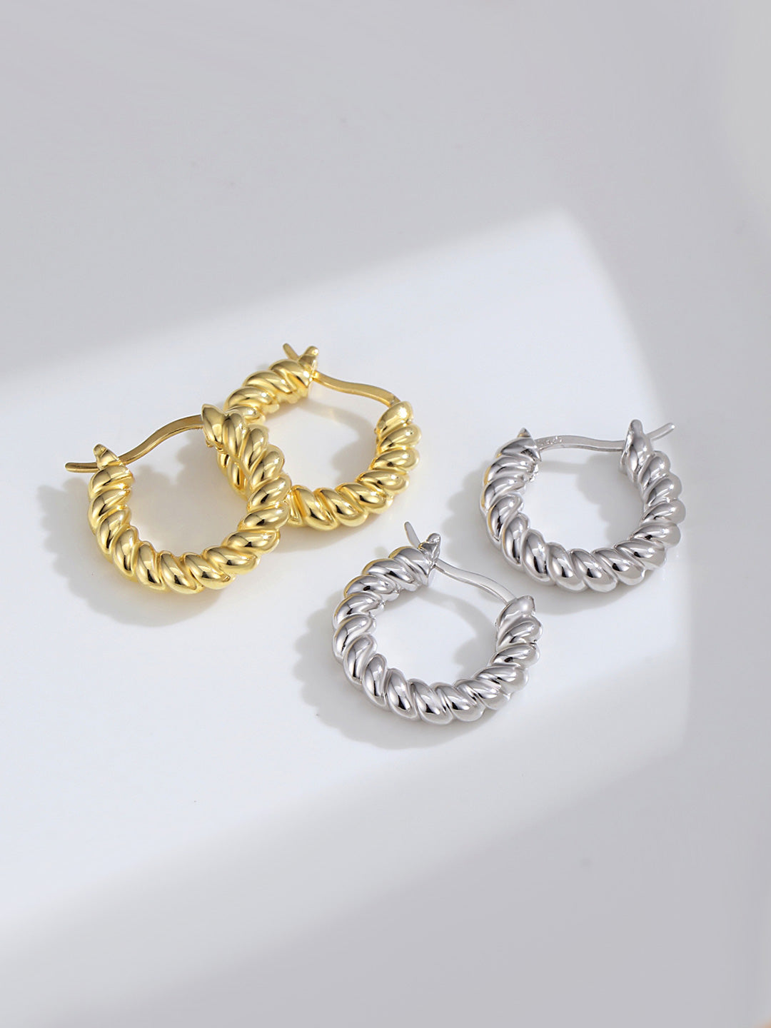 Elegant gold and silver twisted hoops