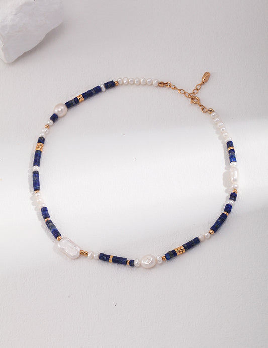 Elegant cobalt blue and white pearl beaded necklace.