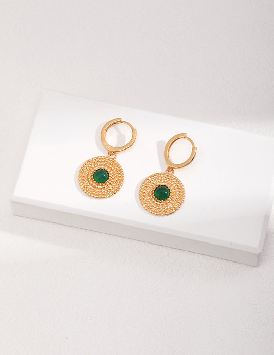 Elegant gold plated green chalcedony earrings on a white background.