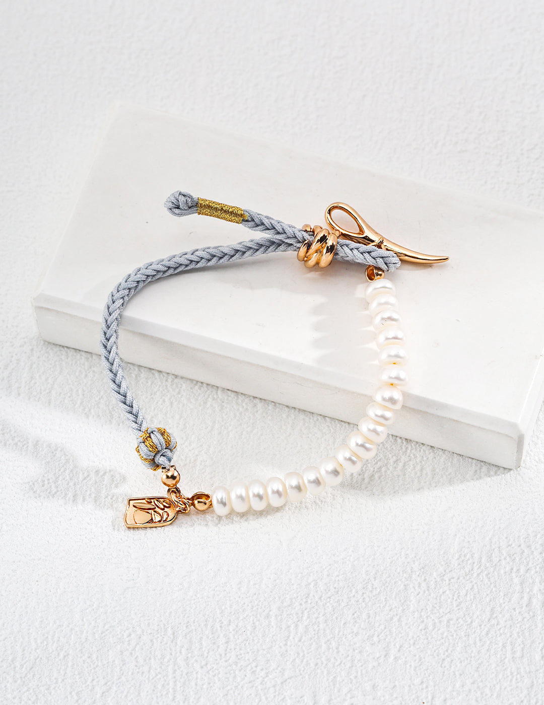 Gold plated baby blue hemp bracelet with stunning pearls.