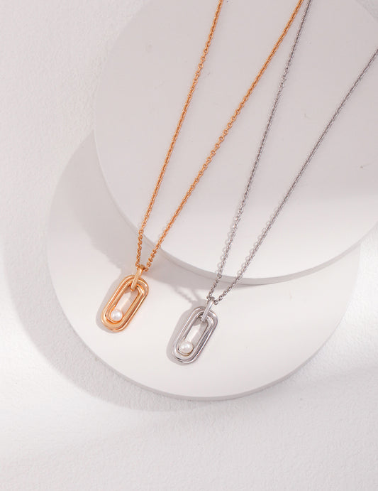  Two elegant necklaces with small oval pendants, one in gold and the other in silver, adorned with silver and gold freshwater pearls.