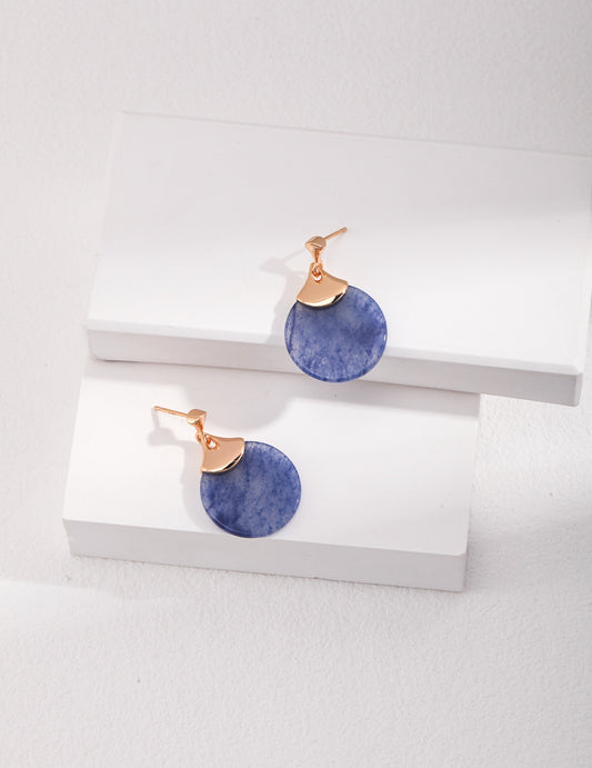 A pair of blue and gold aventurine earrings displayed on a pristine white background.