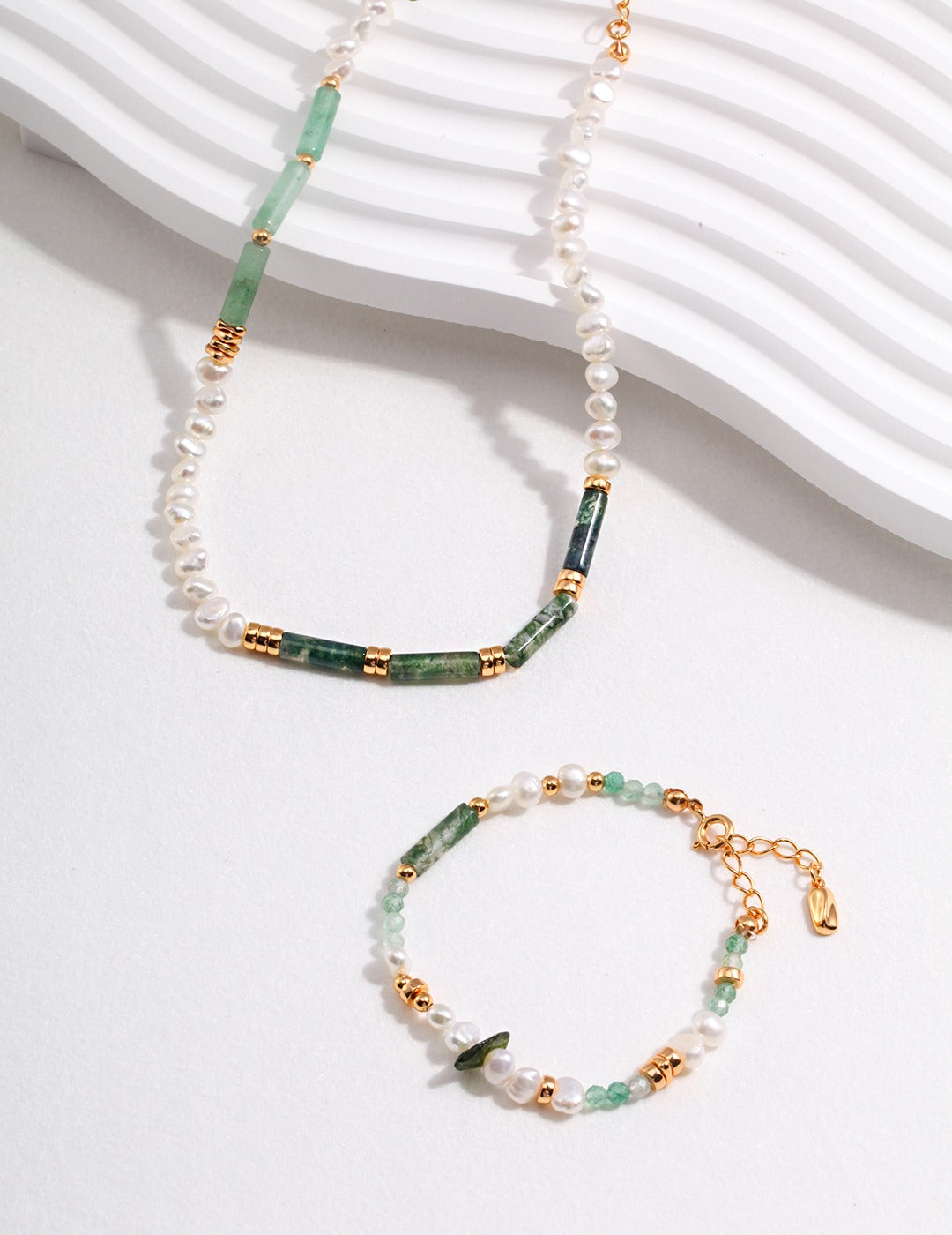 Green necklace and bracelet with gold plated chain, featuring pearls, aventurine, and green moss agate.