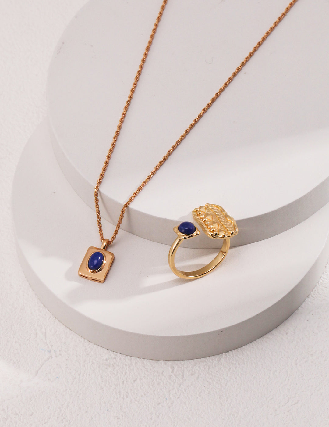 Luxurious gold necklace adorned with stunning blue lapis lazuli stone and ring set