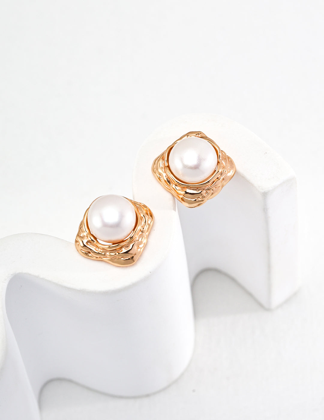 Stylish gold pearl stud earrings