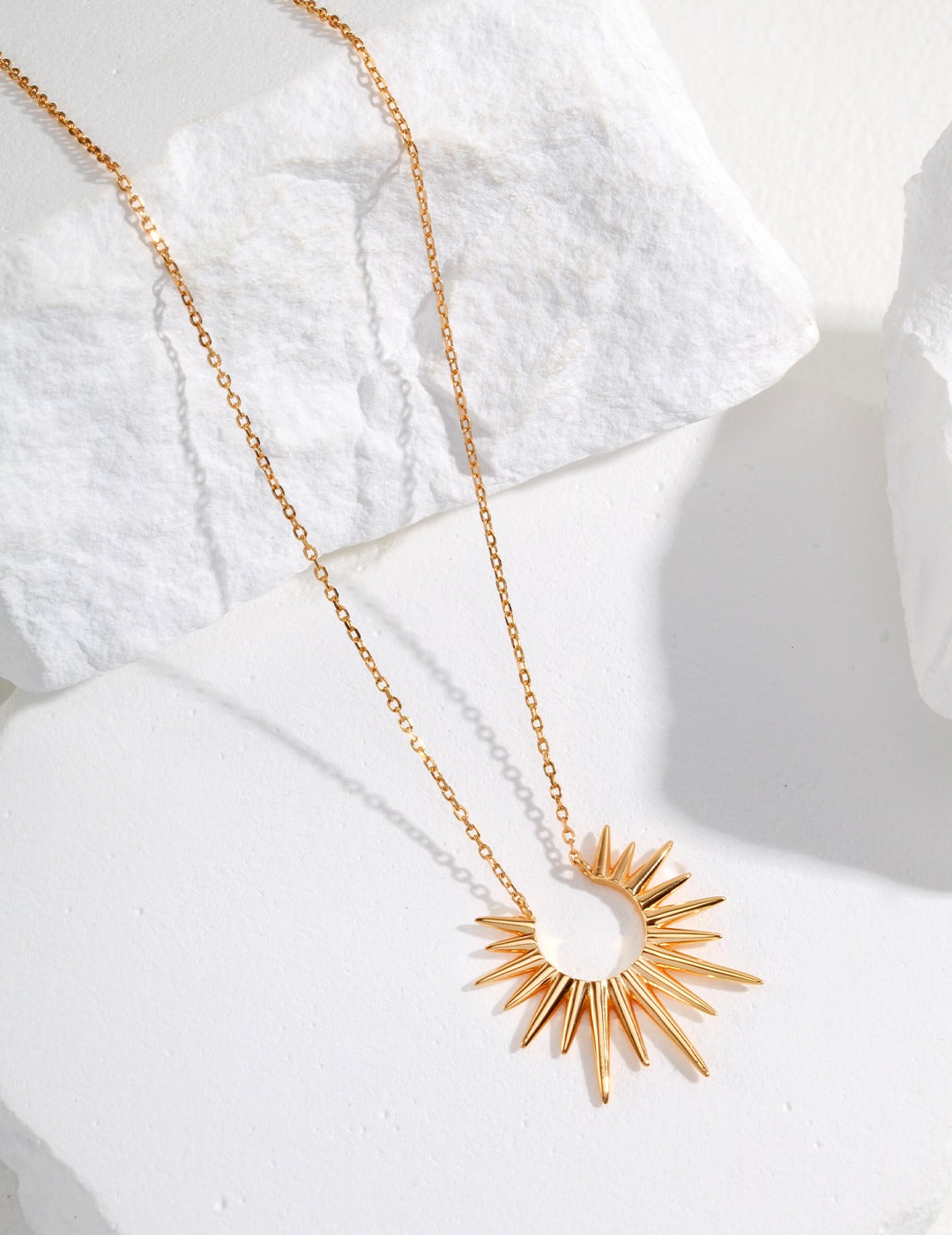 Radiant sunray necklace in gold plated sterling silver, gleaming brightly.